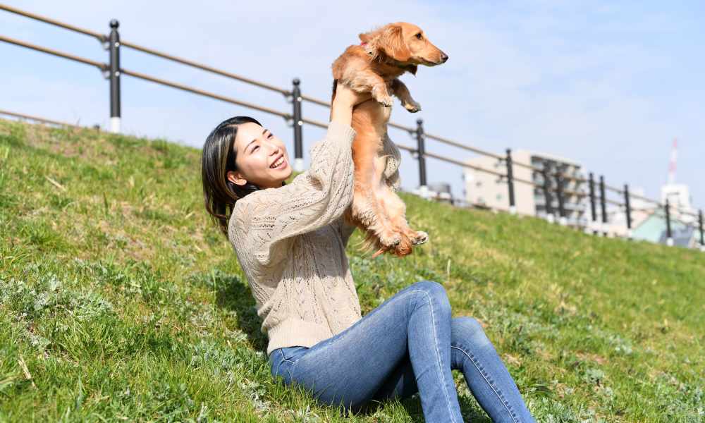 Resident with her pet at a park near Dakota Mill Creek in Buford, Georgia 