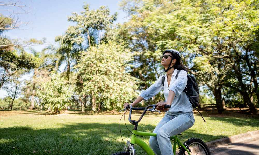 Woman cycling in the neighbourhood at The Manor Townhomes in Winston-Salem, North Carolina