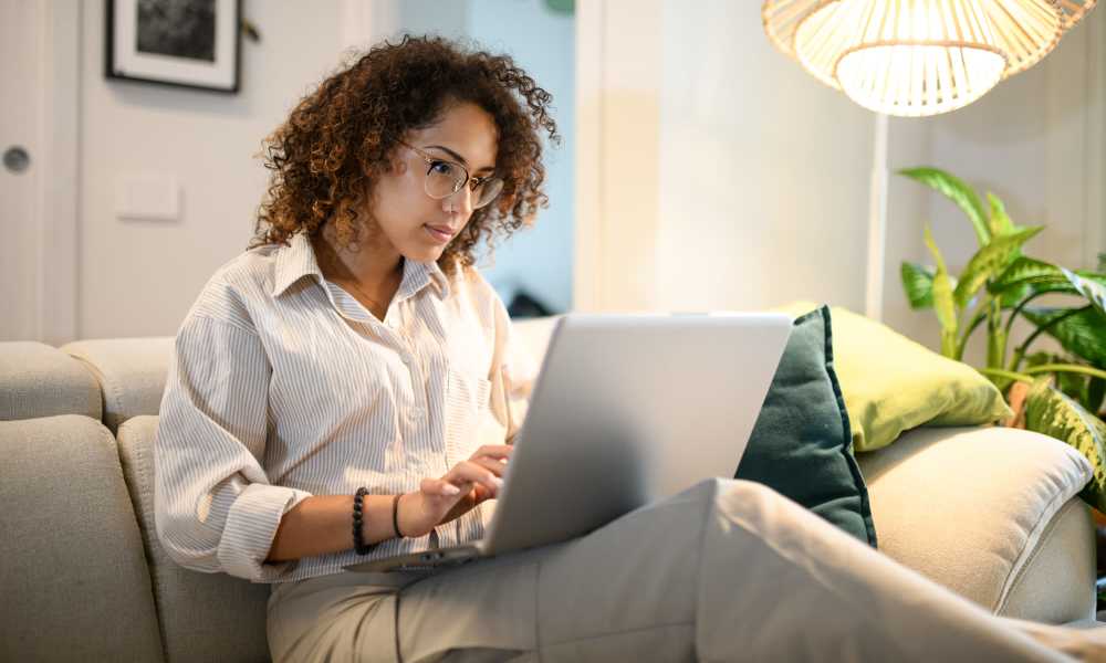 Residents women working in her laptop at 300 North Apartments in Baltimore, Maryland 