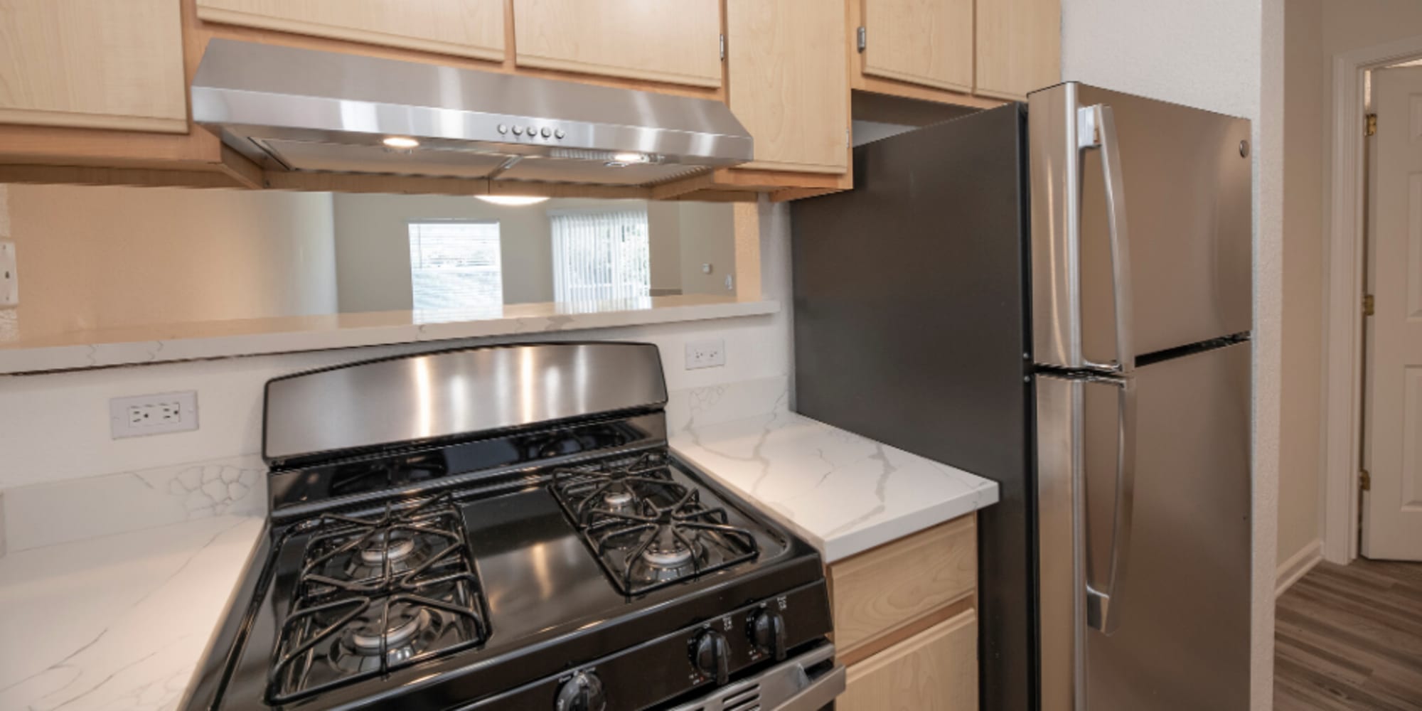 Kitchen with stainless-steel appliances at Granite Creek in Rocklin, California