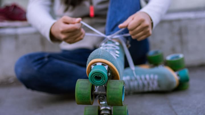 woman putting on skates | Roller Skating in Jacksonville