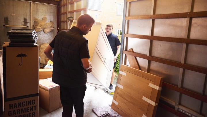 professional movers loading a van | movers in Peoria