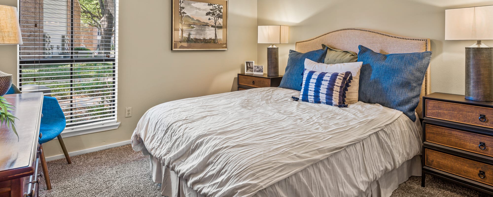 Bedroom with a couch and ceiling fan at Raintree in Shreveport, Louisiana