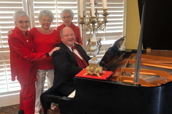 Three residents and a piano player at Wesley Gardens in Montgomery, Alabama