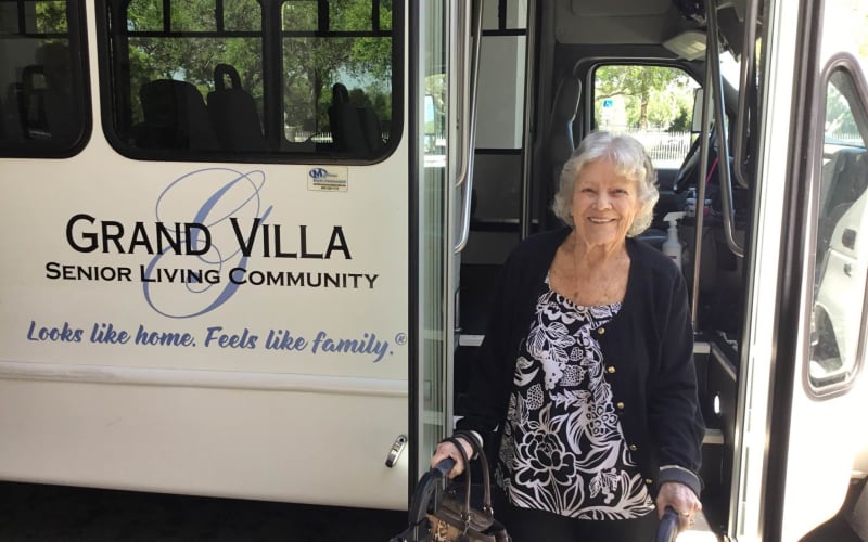 Resident getting off the Grand Villa bus after a trip at Grand Villa of Deerfield Beach in Deerfield Beach, Florida