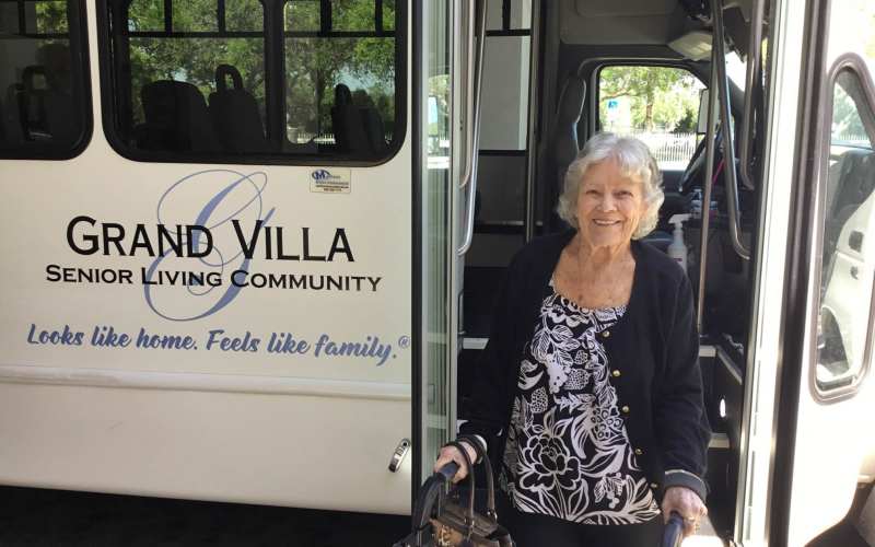 Resident getting off the Grand Villa bus after a trip at Grand Villa of Port Charlotte in Port Charlotte, Florida