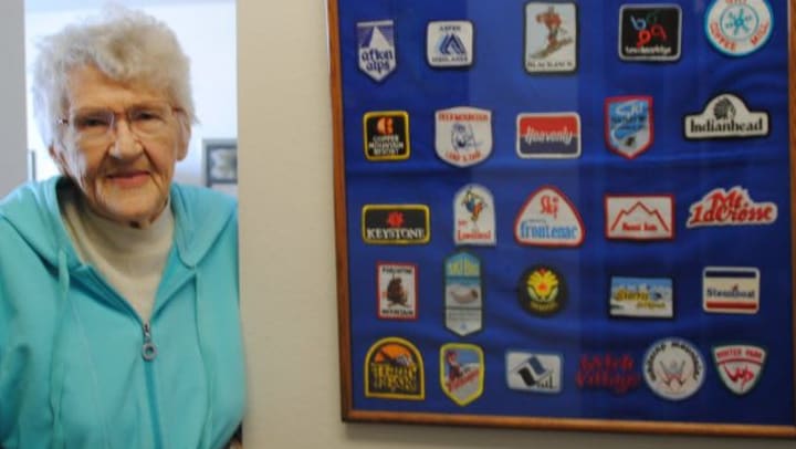 Shirley and a framed collection of patches