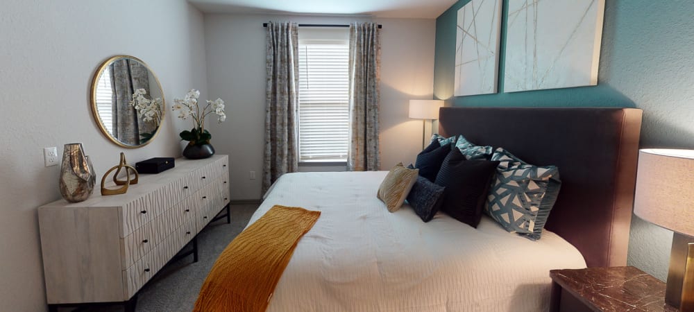 Nice well lit bedroom in a decorate model home at Integra 289 Exchange in DeBary, Florida