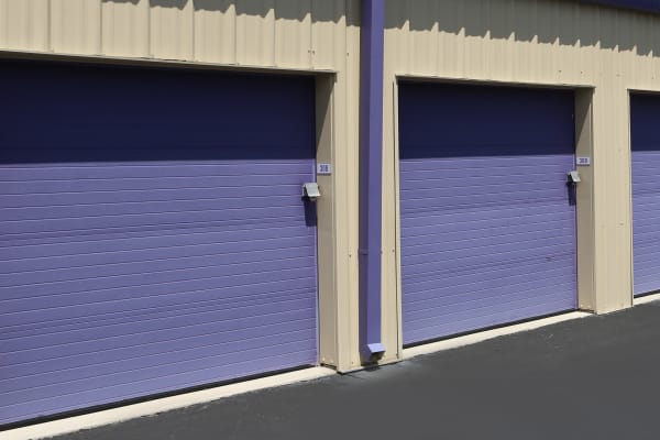 Exterior of some of our storage units with purple doors at Midgard Self Storage in Jacksonville, Florida