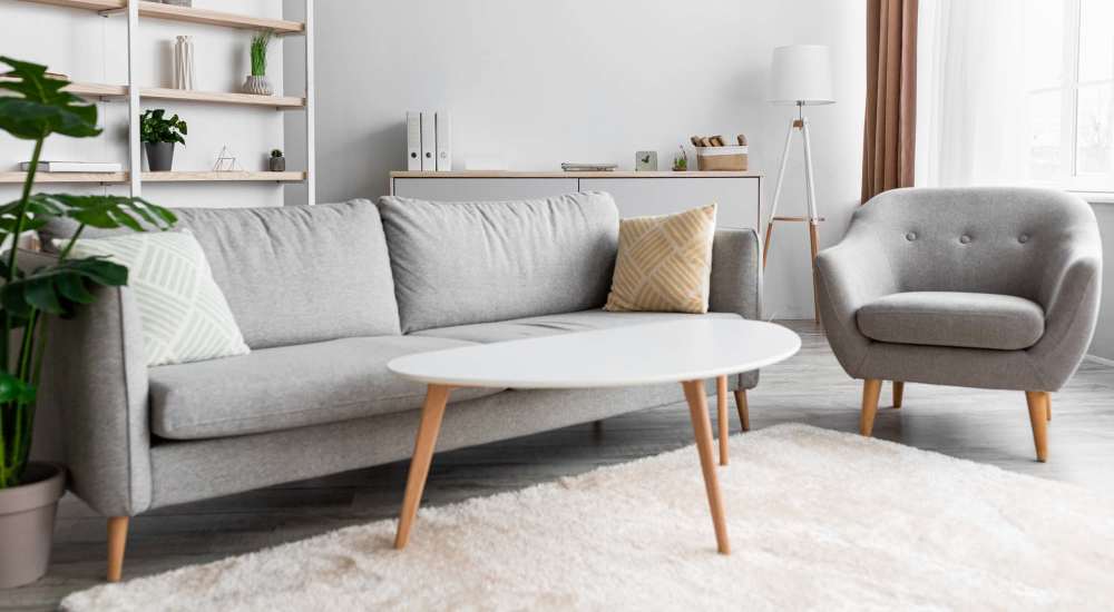 Living room with sofa at Encino Crest Apartments in Encino, California