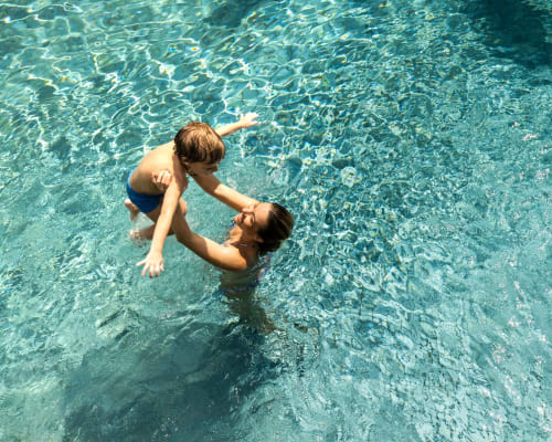 Parent and child playing in the pool at Park Terrace in High Point, North Carolina