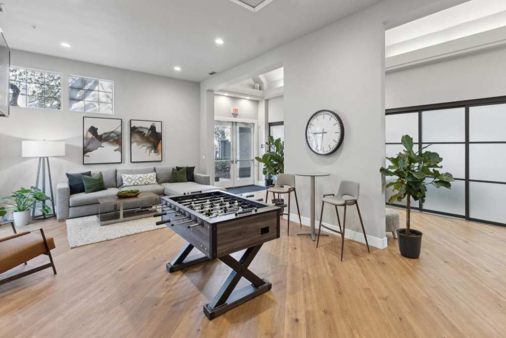 A clubhouse with plenty of seating for entertaining guests at Mill Springs Park Apartment Homes in Livermore, California