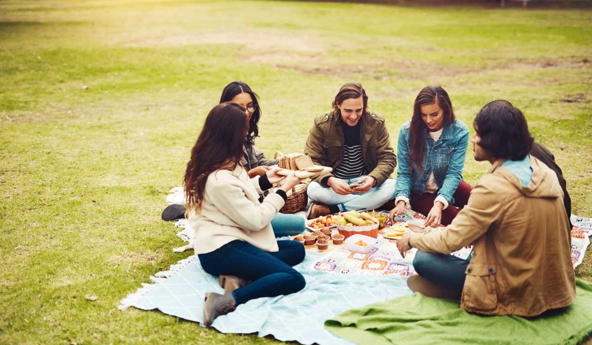 Resident friends having snacks in the local park near The Edison at Madison in Madison, Alabama