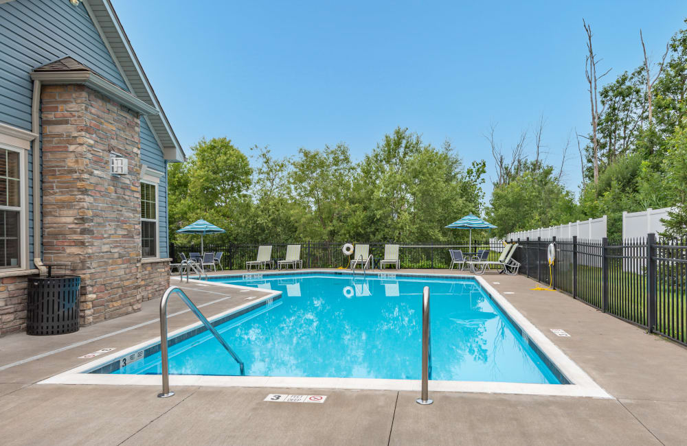 Sparkling swimming pool and sundeck at North Ponds Apartments & Townhomes in Webster, New York