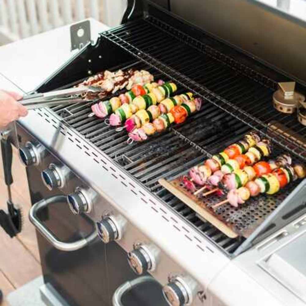 Outdoor barbeque station at The Haven at Grand Landing Apartments in Grand Haven, Michigan