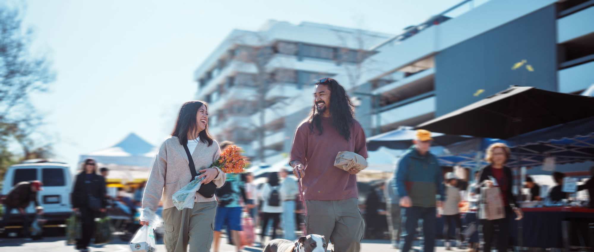 A resident couple walking in a street near St Tropez Apartments in Marina Del Rey, California  