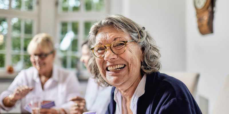 Resident smiling at the camera at The Barclay at ParkSquare in Aventura, Florida