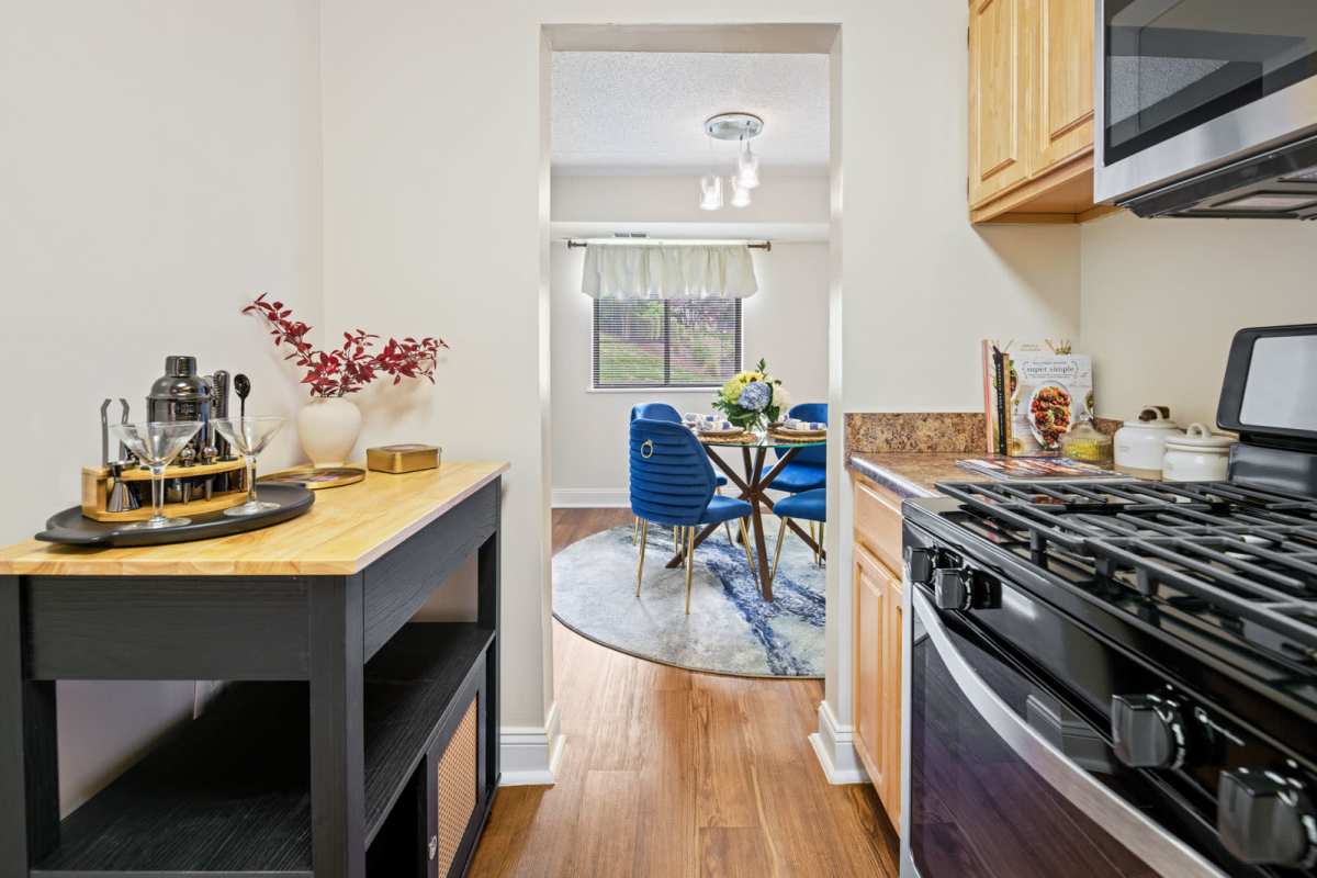 Modern kitchen with wooden cabinets at Windsor Court and Tower in Silver Spring, Maryland