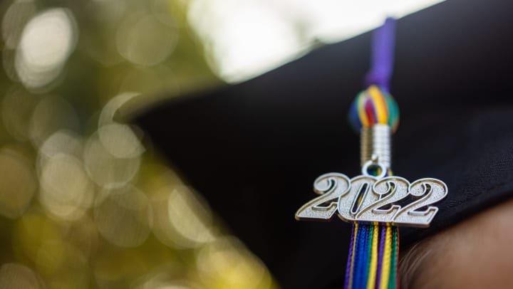 Close-up of a 2022 graduation tassel on a graduation cap.