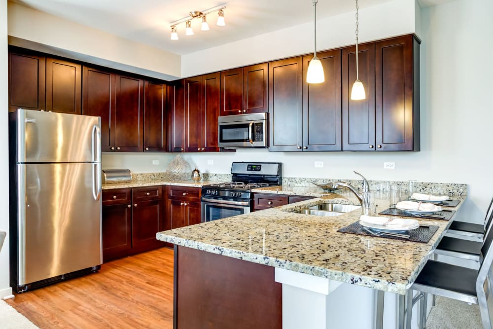 Kitchen with stainless steel appliances at The Oaks Of Vernon Hills in Vernon Hills, Illinois