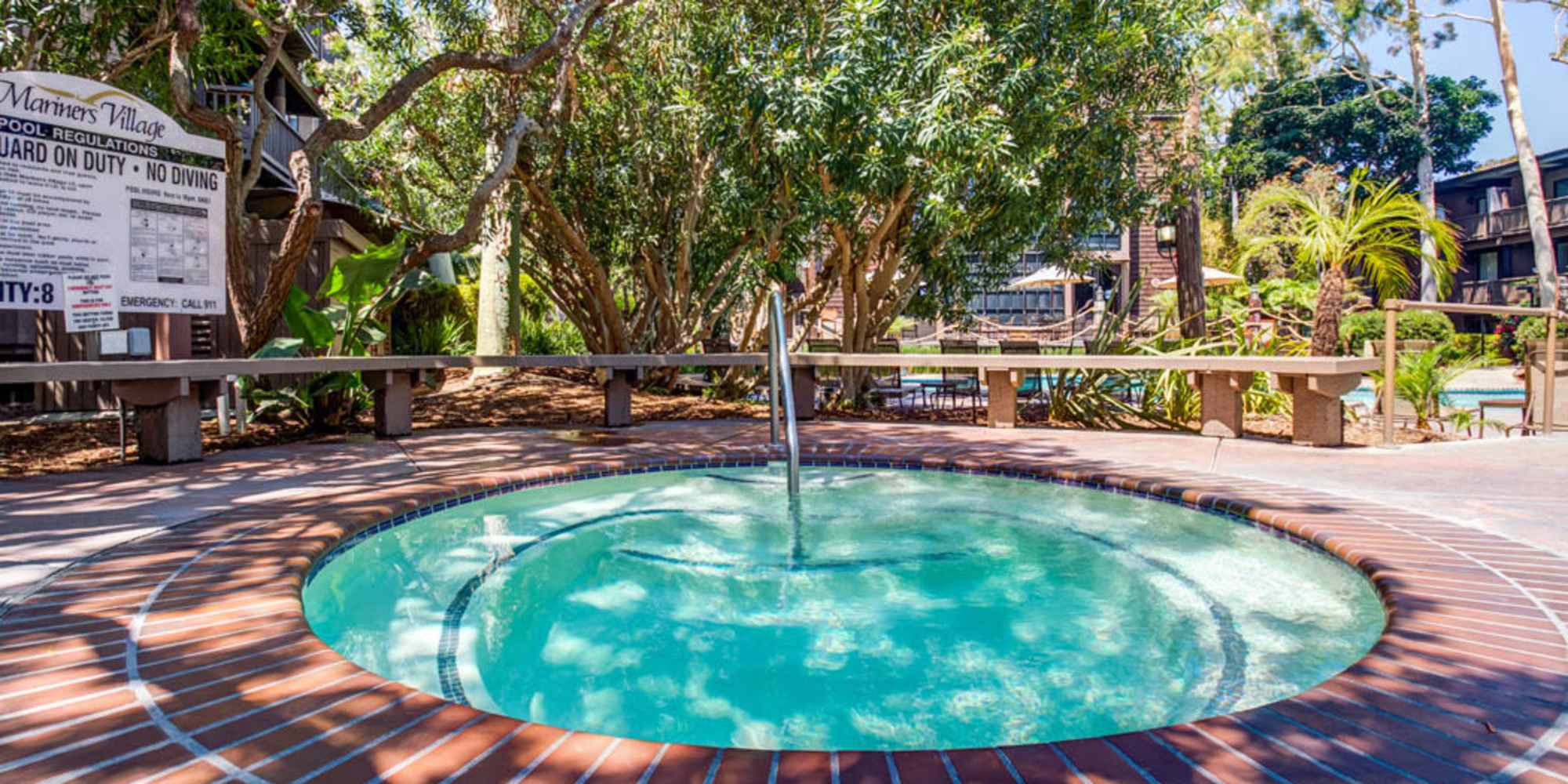 Outdoor spa surrounded by mature trees at Mariners Village in Marina del Rey, California