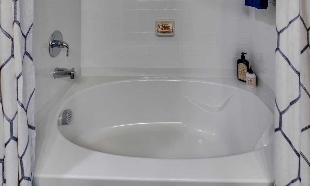 Shower bath combo in model bathroom at Bellrock Upper North in Haltom City, Texas