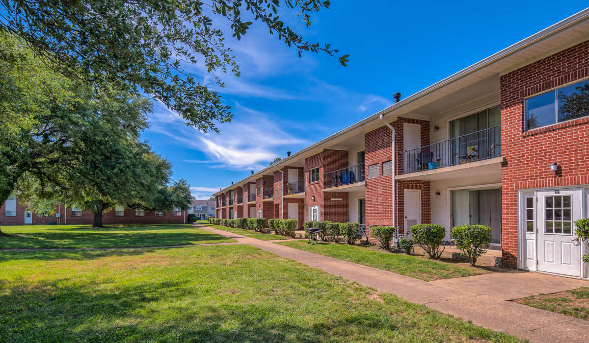 Exterior with walking path at Country Club Apartments in Hampton, Virginia