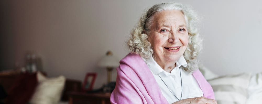 A smiling resident in her apartment at Peaks at Millcreek in Salt Lake City, Utah