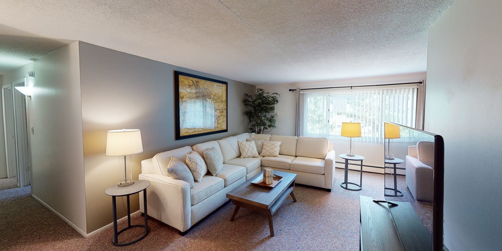 Living room with TV at Tanglewood Apartments & Townhomes in Erie, Pennsylvania