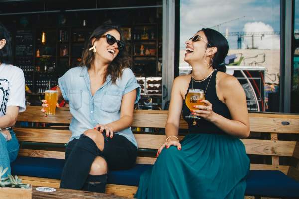 Friends enjoying their chilled bear near  The Lofts At West 7th in Fort Worth, Texas