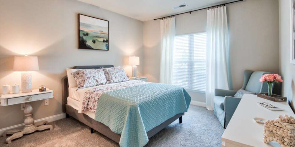Bright bedroom with night stand, lamp and windows at 4830 Wescott in Summerville, South Carolina                 
