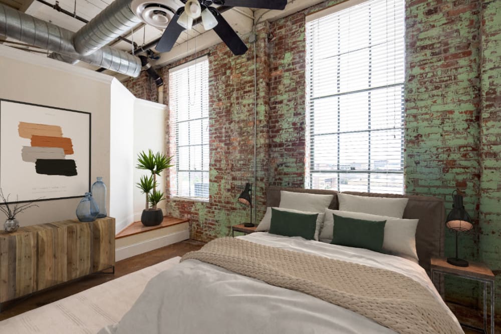 Industrial style living spaces with large windows at Broadway Lofts in Macon, Georgia