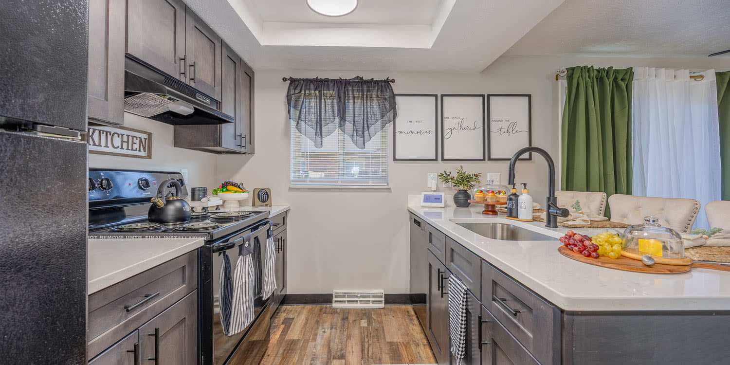 Open kitchen with dining space in Eden at Bexley Crossing in Columbus, Ohio