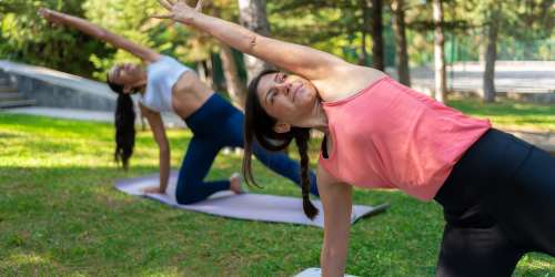 Residents doing yoga in a park near Parkview Village in Kissimmee, Florida