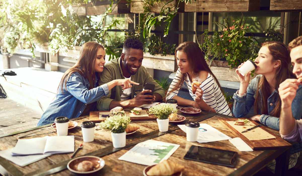Group of residents enjoying food at The Edison at Madison in Madison, Alabama