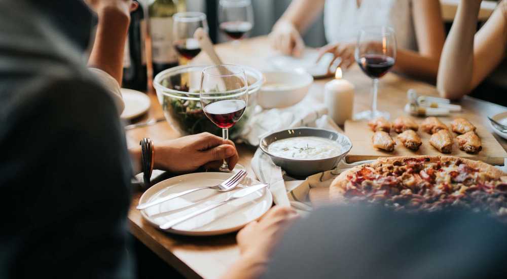 A group of residents having meals near The Lofts At Clifford Brown Walk in Wilmington, Delaware