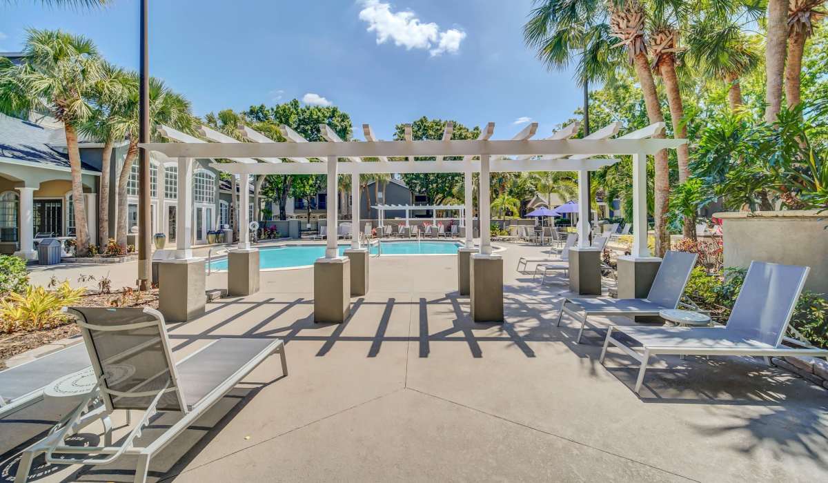 Sparkling saltwater swimming pool and lounge beds at The Summit At Metrowest in Orlando, Florida