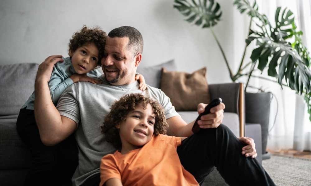 Happy family in the living room at 2370 Main at Sugarloaf in Duluth, Georgia 