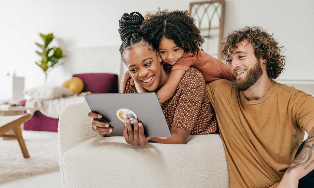 Happy resident family checking their apartment home at The Manor Townhomes in Winston-Salem, North Carolina