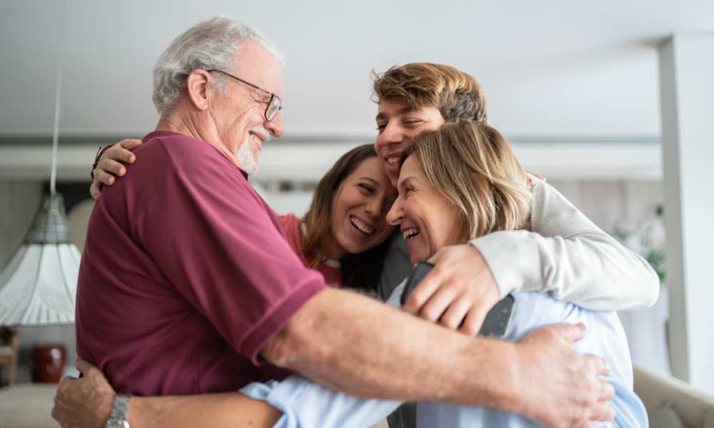Happy family hugging each other at Yukon on 15th in Yukon, Oklahoma