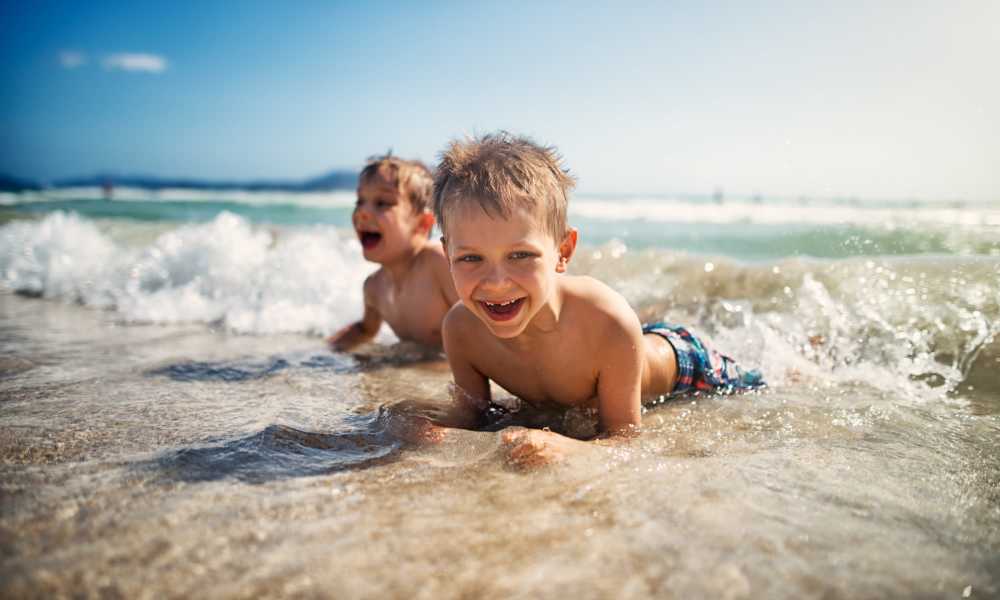 Kids enjoying the beach near Capri Apartments in Marina Del Rey, California.