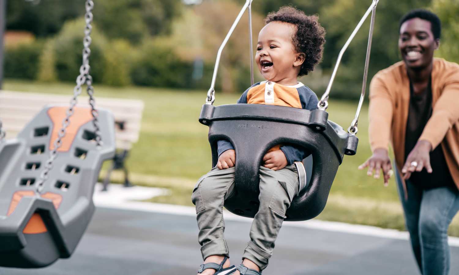 Child laughing on a swing at Ardmore & Twenty Eighth in Atlanta, Georgia 