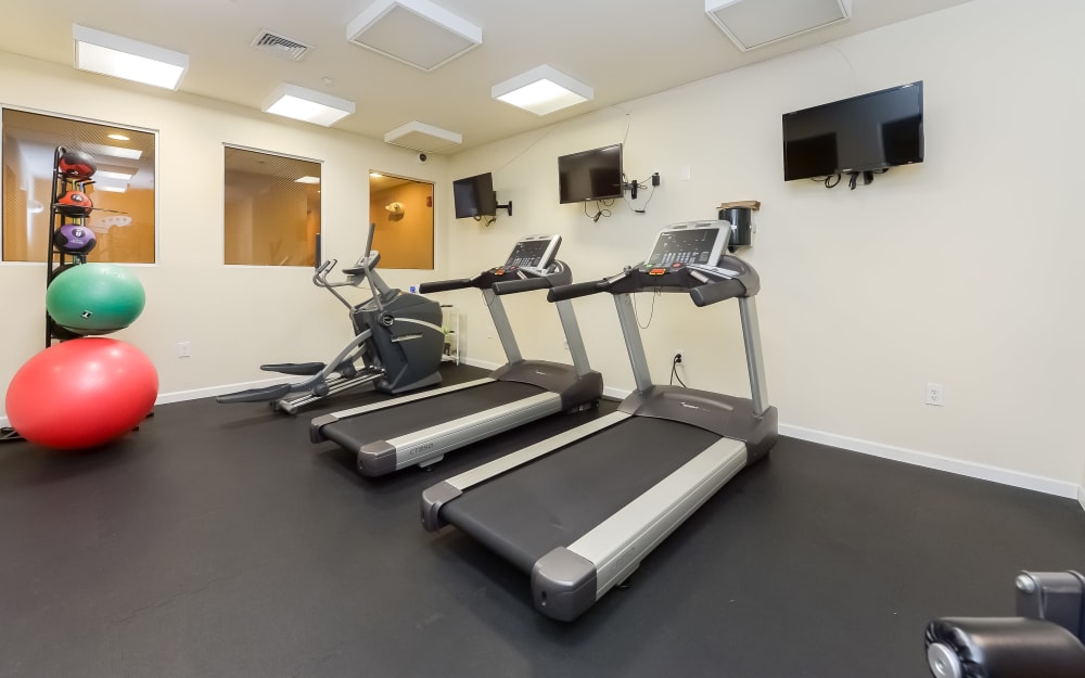 Well-equipped fitness center with cardio equipment at Cranford Crossing Apartment Homes in Cranford, New Jersey