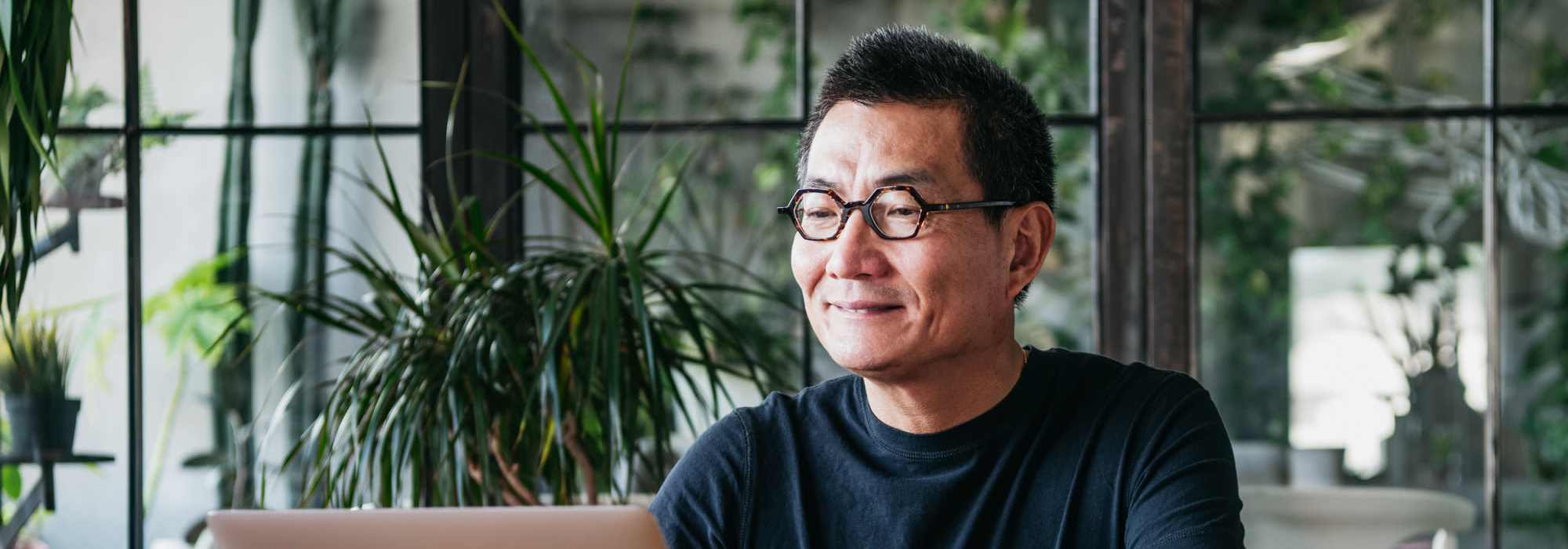 A man with glasses smiling | Residents at Ventura Park Plaza Apartments in Portland, Oregon