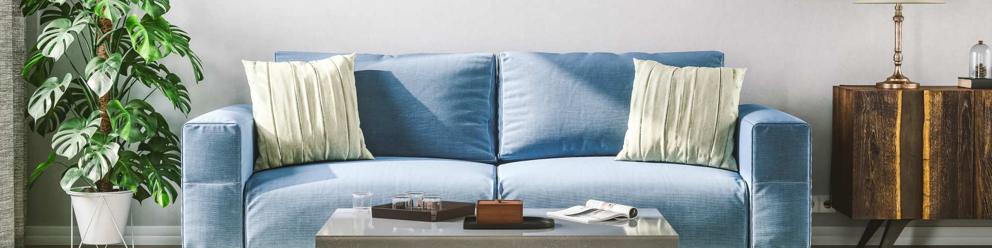 Blue couch and living room set at The Lucas Apartments in Dallas, Texas