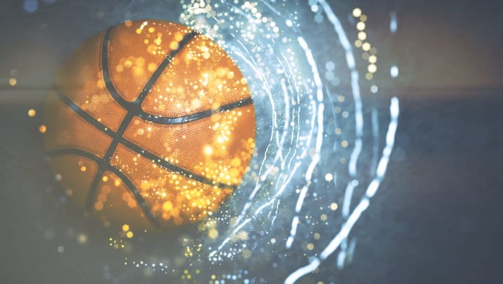 Basketball with flares of light around it.