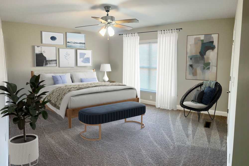 Bedroom with bed bench at Madison Pines Apartment Homes in Madison, Alabama
