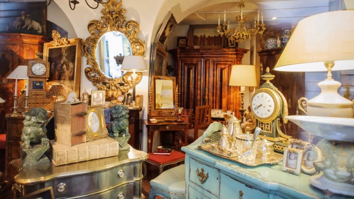  Interior of antique store with mirrors, cabinetry, lamps, and clocks