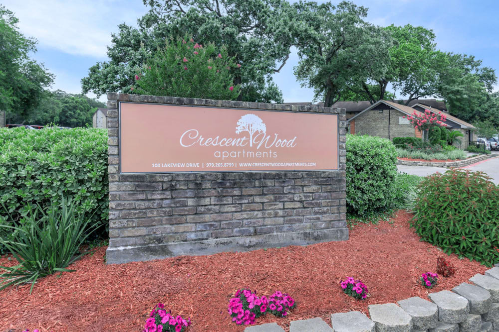 Community sign at CrescentWood Apartments in Clute, Texas