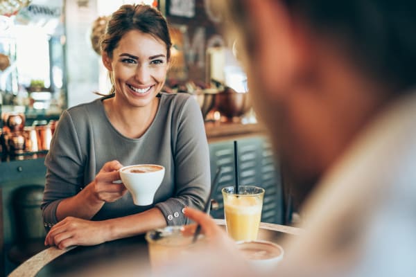  A resident drinking coffee near BB Living at Civic Square in Goodyear, Arizona